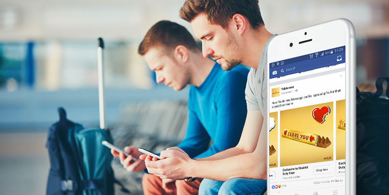 men using their mobile phone in an airport